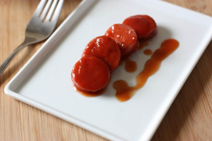 Kentucky Bourbon Dogs | Fake Food Free | Sliced grass-fed hotdogs slow cooked in a sauce spiked with bourbon. 