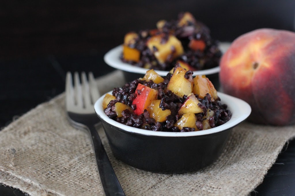 A sweet and savory snack or side recipe with black rice, peaches, and tomatoes in a honey dressing!