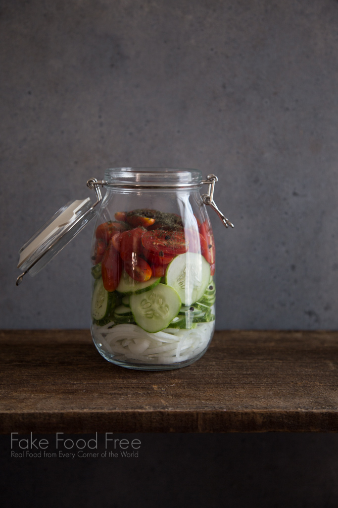 Summer Salad Recipe in a Jar with tomatoes, onions, cucumbers and dill | FakeFoodFree.com