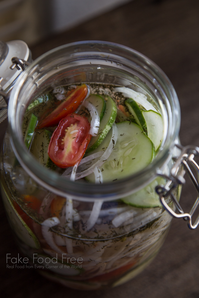 Quick Pickled Salad Recipe with tomatoes, cucumbers, and onions