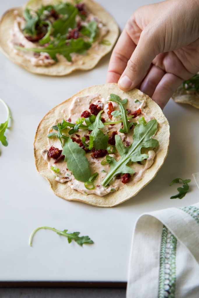 Arugula Sundried Tomato Tostadas Recipe | FakeFoodFree.com