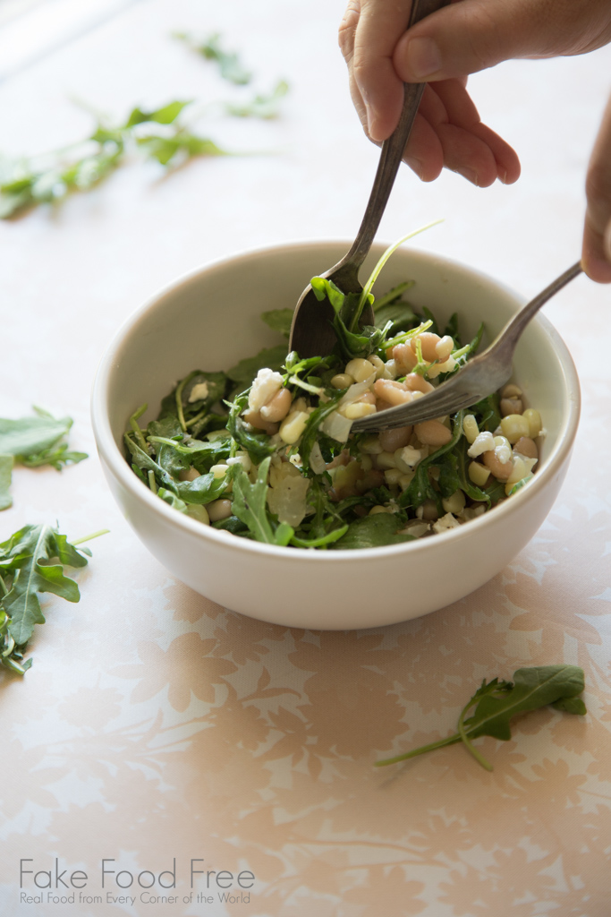 Skillet sweet corn with white beans tossed with arugula and topped with feta | Recipe | FakeFoodFree.com