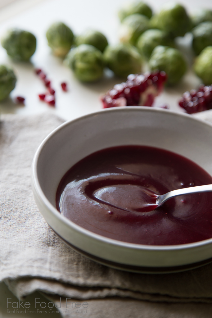 A festive pomegranate molasses dressing or sauce recipe made with maple syrup and Dijon mustard. | FakeFoodFree.com