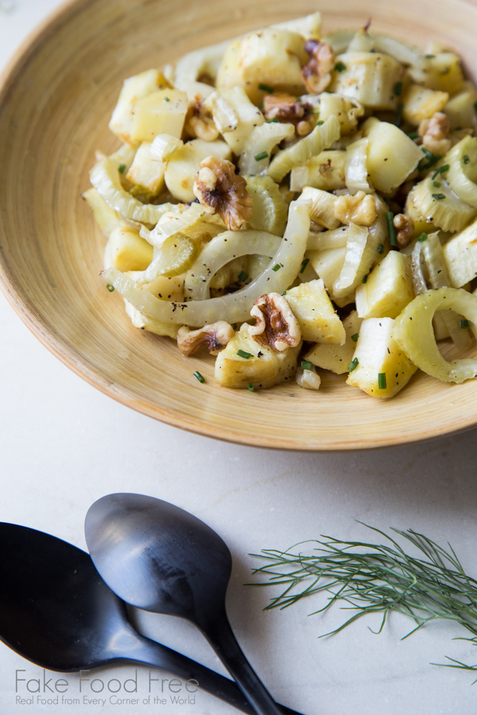 Fennel and parsnips roasted until tender and topped with walnuts and chives. | Recipe at FakeFoodFree.com