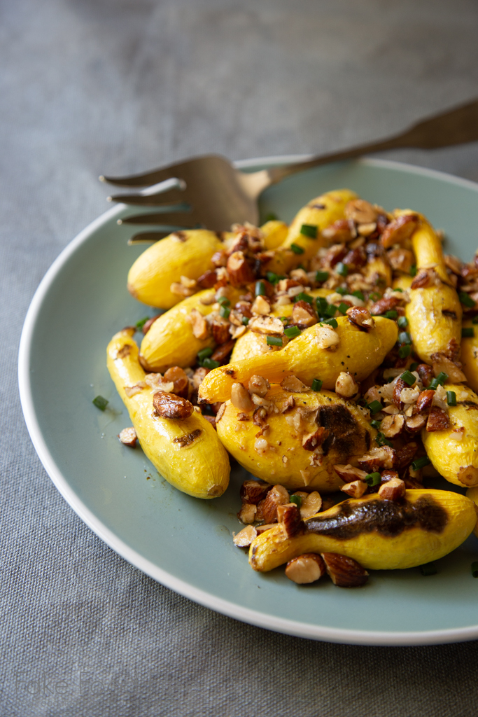 Grilling season is here! Grilled Baby Yellow Squash with Smoked Almond and Garlic Crumble Recipe | FakeFoodFree.com