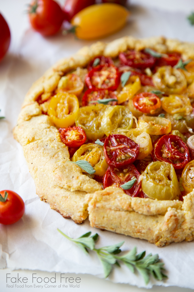 Parmesan Cornmeal Crusted Heirloom Cherry Tomato Galette Recipe | FakeFoodFree.com #summer #recipes #tomatoes #galette