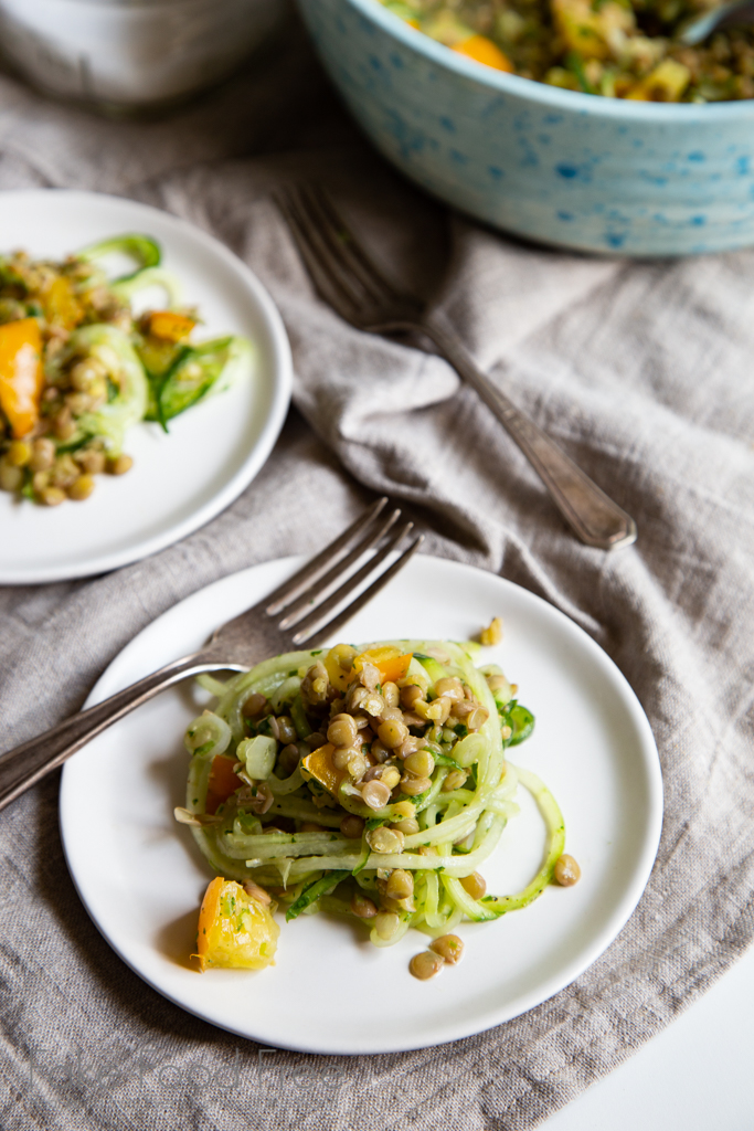Late Summer Lentil Salad recipe with cucumbers, yellow tomatoes, and cilantro dressing. #healthyeating #salads #saladrecipes #vegan
