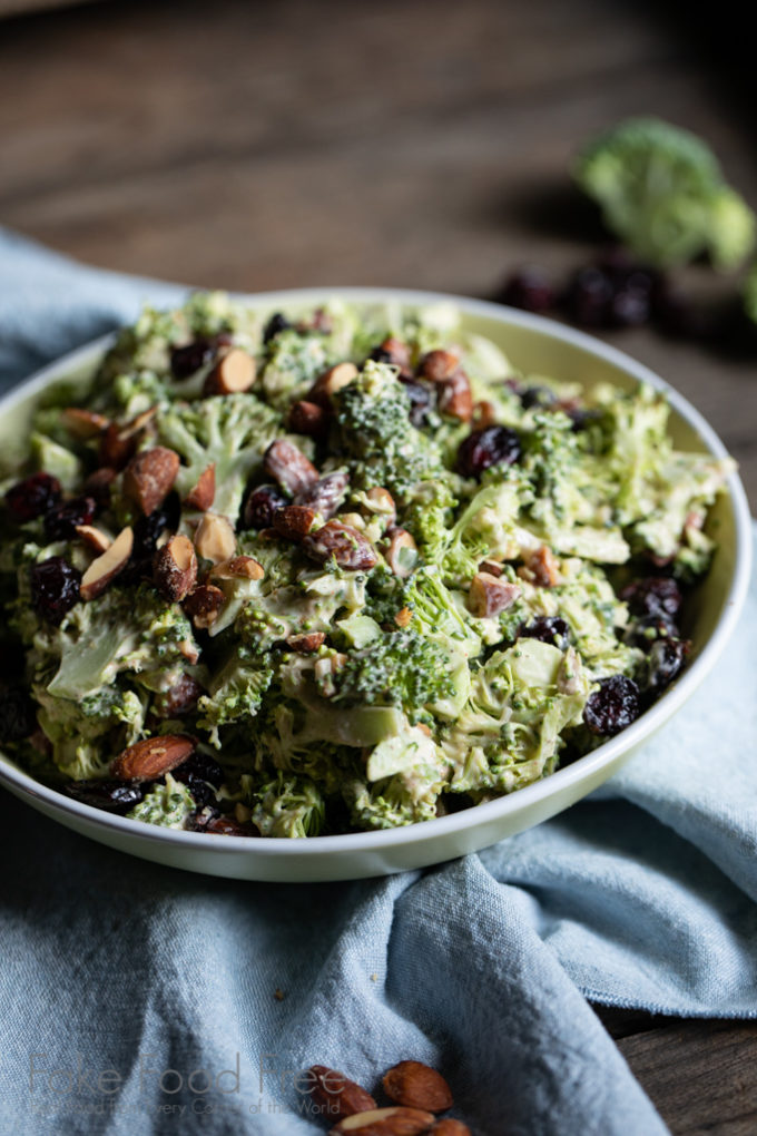 Sweet and Smoky Broccoli Salad Recipe | Bacon-free, made with less mayo and more flavor. | FakeFoodFree.com #broccolisalad #sidedish #healthyeating #meatfree #vegetables #partyfood #picnicfood #potluckideas

