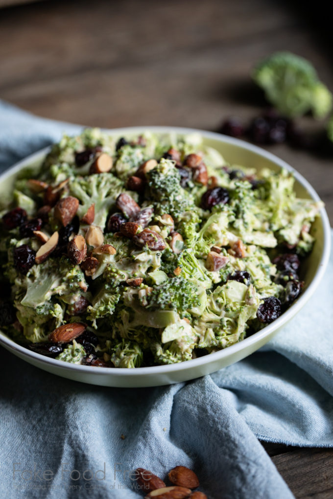 Sweet and Smoky Broccoli Salad Recipe | Bacon-free, made with less mayo and more flavor. | FakeFoodFree.com #broccolisalad #sidedish #healthyeating #meatfree #vegetables #partyfood #picnicfood #potluckideas