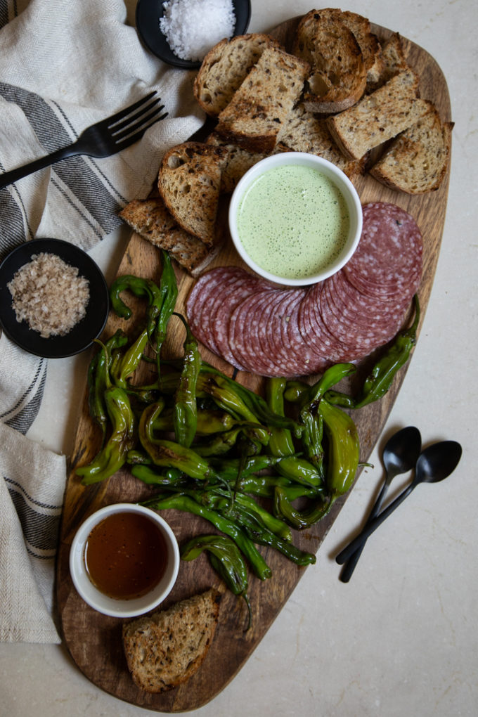 Shishito Pepper Board with Cilantro Crema and Tequila Honey | FakeFoodFree.com #appetizers #partyfood #partyideas #charcuterieboard #starters 