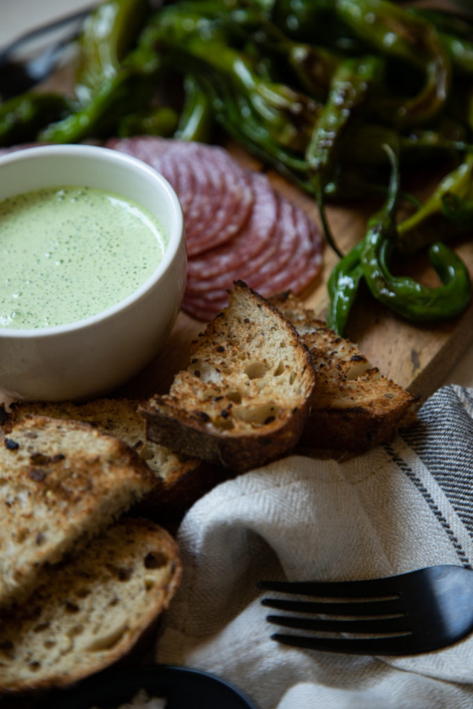 Shishito Pepper Board served with Cilantro Crema and Tequila Honey | FakeFoodFree.com #appetizers #partyfood #partyideas #charcuterieboard #starters 