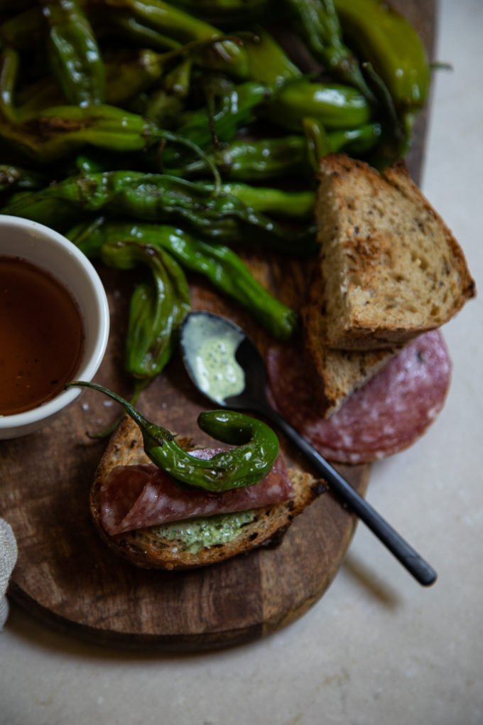 Appetizer Board with Shishito Peppers, Cilantro Crema and Tequila Honey | FakeFoodFree.com #appetizers #partyfood #partyideas #charcuterieboard #starters 